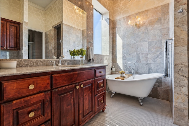 bathroom with vanity, tile patterned flooring, tile walls, and separate shower and tub