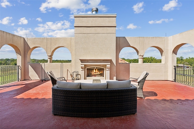 view of patio / terrace with exterior fireplace