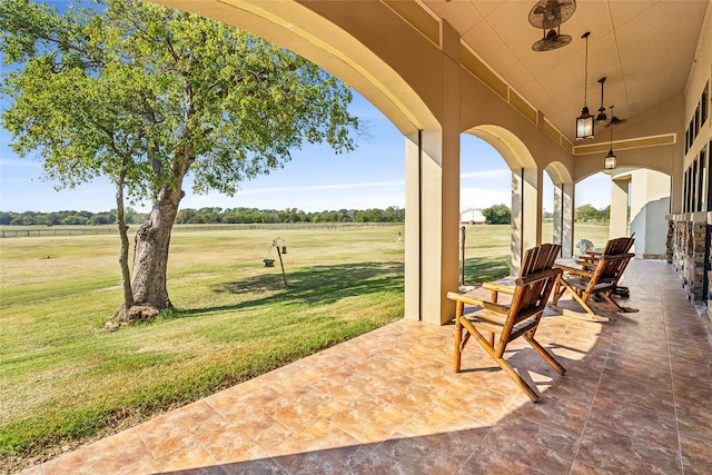 view of patio / terrace with a rural view