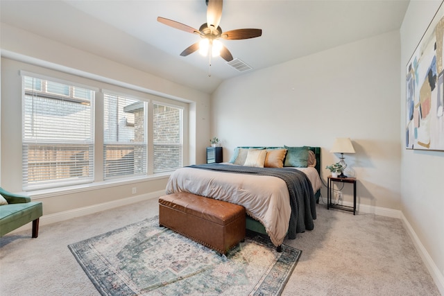 carpeted bedroom featuring vaulted ceiling and ceiling fan