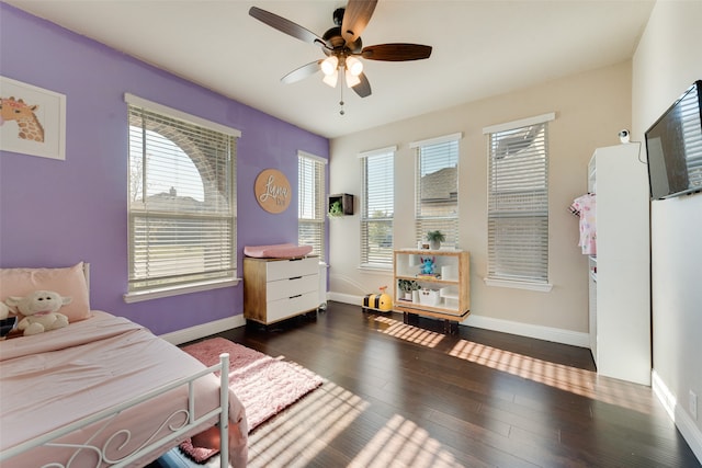 bedroom featuring dark wood-type flooring and ceiling fan