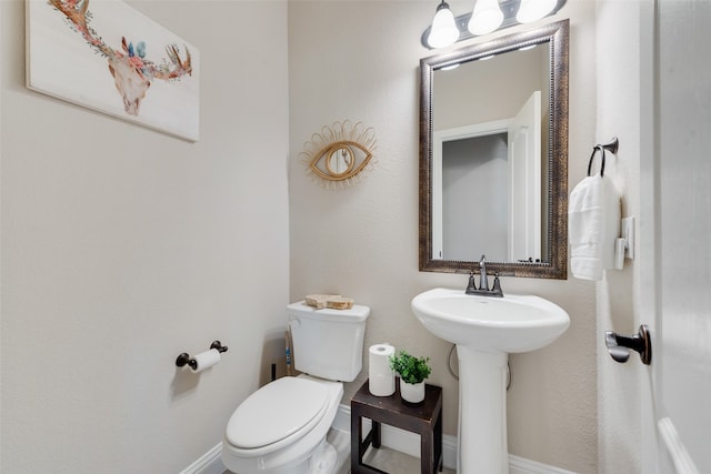 bathroom with sink and toilet