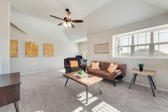 living room featuring ceiling fan, lofted ceiling, and light colored carpet