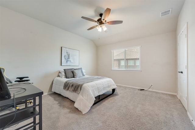 carpeted bedroom featuring vaulted ceiling and ceiling fan