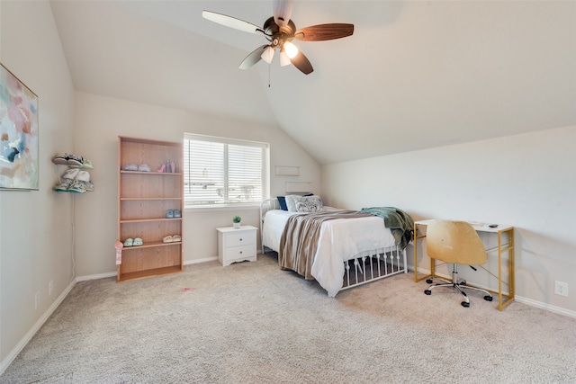 bedroom featuring light carpet, vaulted ceiling, and ceiling fan