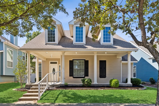 view of front of home with a front lawn and covered porch