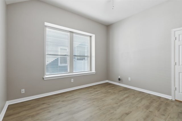 unfurnished room with light hardwood / wood-style floors