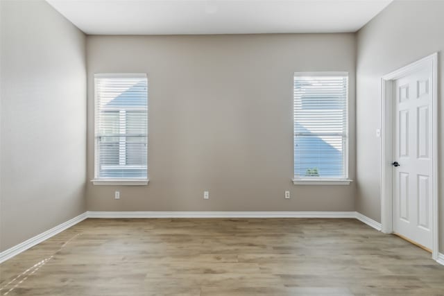 spare room with light hardwood / wood-style floors