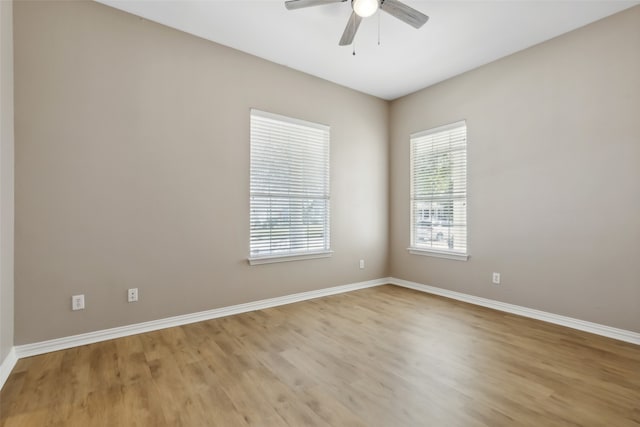 spare room with light hardwood / wood-style floors and ceiling fan