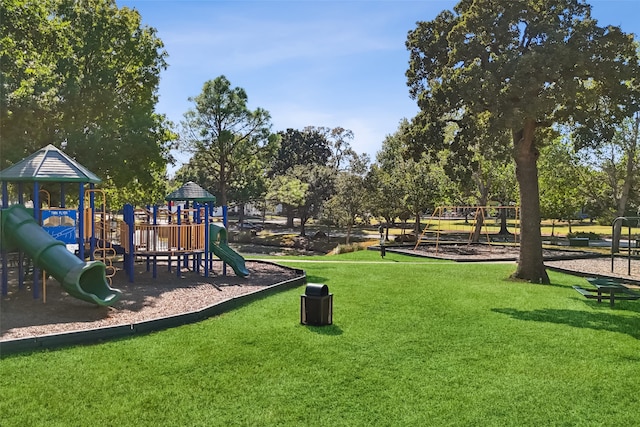 view of jungle gym featuring a lawn