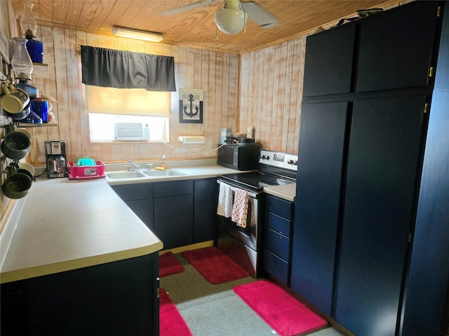 kitchen with ceiling fan, sink, wood walls, electric stove, and wood ceiling