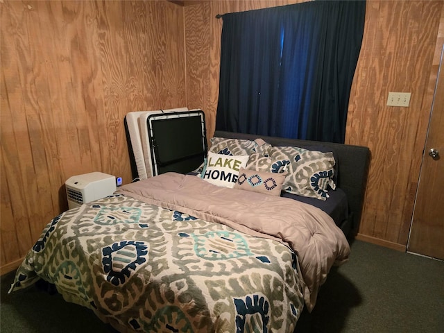 carpeted bedroom featuring wood walls