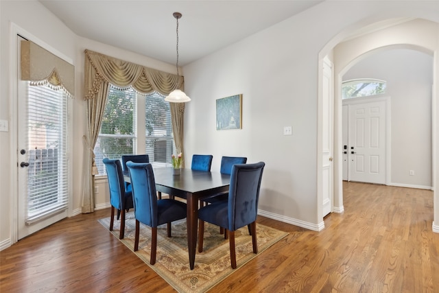 dining space featuring light wood-type flooring