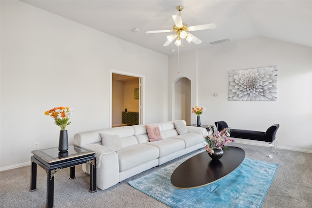 carpeted living room featuring vaulted ceiling and ceiling fan