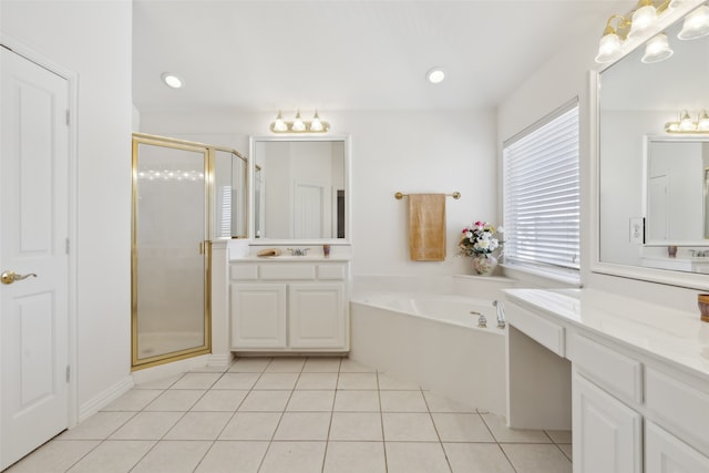 bathroom featuring vanity, shower with separate bathtub, and tile patterned floors