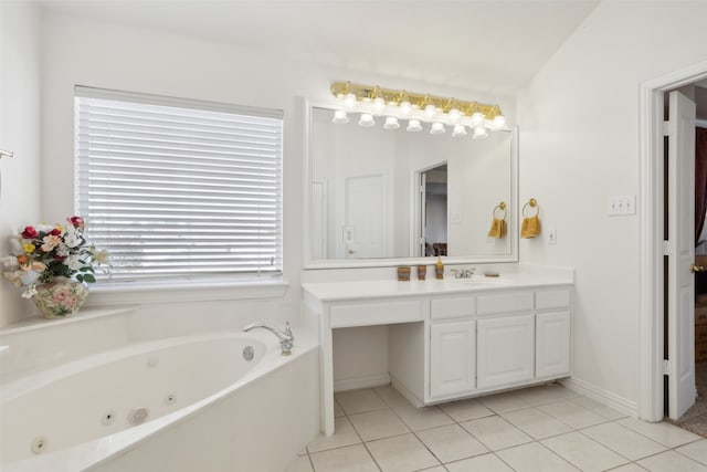 bathroom with vanity, a tub to relax in, tile patterned floors, and vaulted ceiling