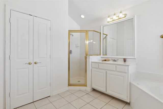 bathroom featuring vanity, tile patterned floors, and independent shower and bath