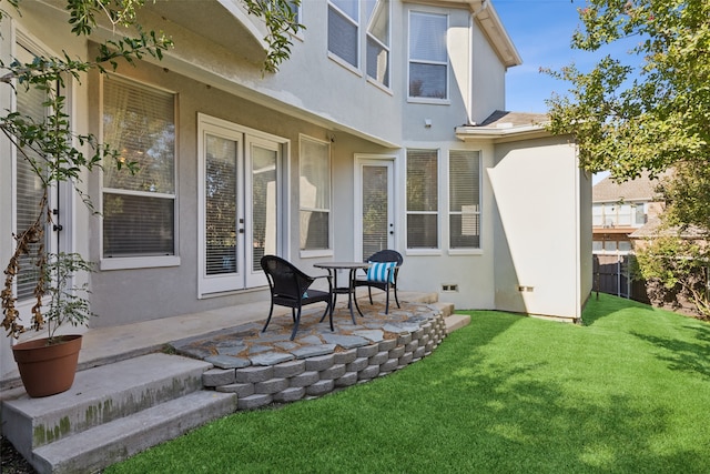 rear view of property with a patio area and a yard