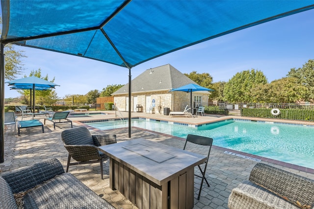 view of swimming pool featuring a patio