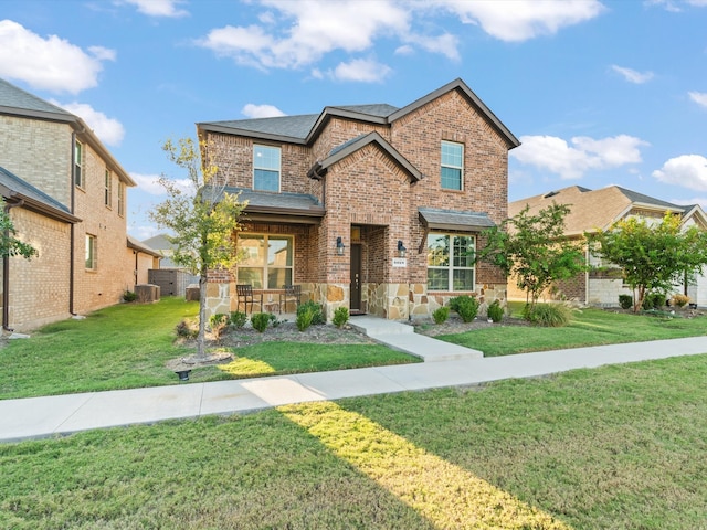 craftsman-style house featuring a front lawn