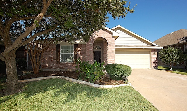 ranch-style home with a front yard and a garage