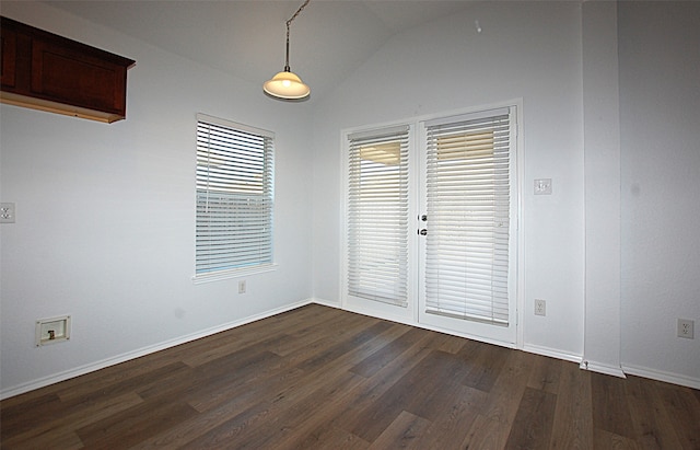 interior space featuring lofted ceiling and dark hardwood / wood-style floors