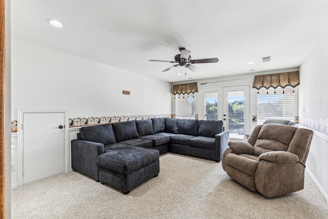 living room with french doors, ceiling fan, and carpet floors