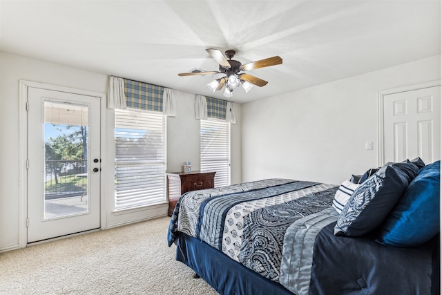 bedroom featuring french doors, ceiling fan, carpet floors, and access to exterior