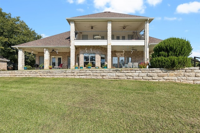 back of house with a balcony, a yard, a patio, and ceiling fan