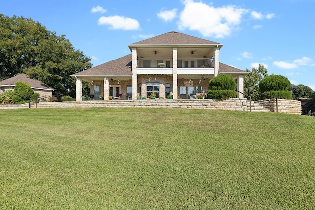 back of property featuring a lawn