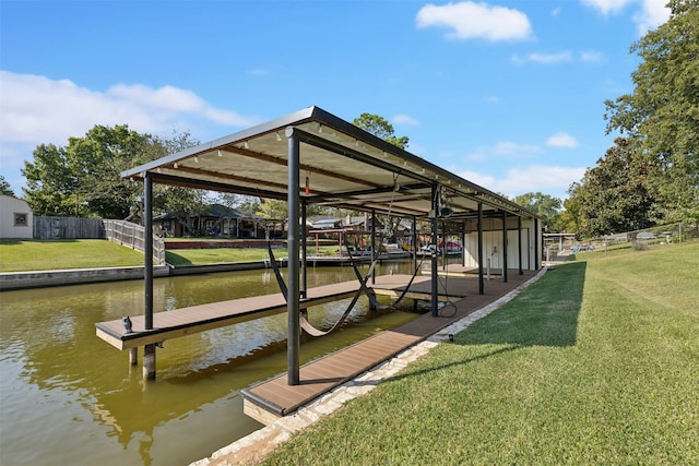 dock area featuring a yard and a water view