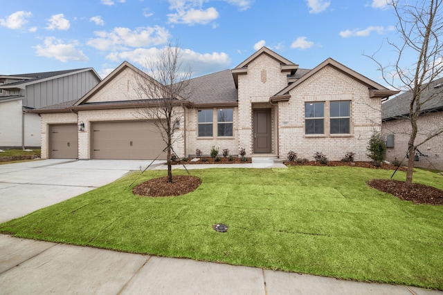 single story home with a garage, concrete driveway, a front lawn, and brick siding