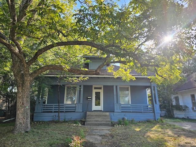 view of front of property featuring covered porch