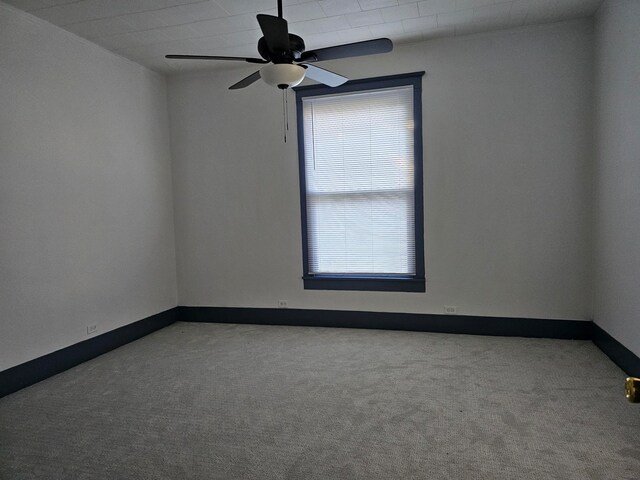 empty room with light carpet and ceiling fan