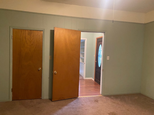 unfurnished bedroom with light carpet