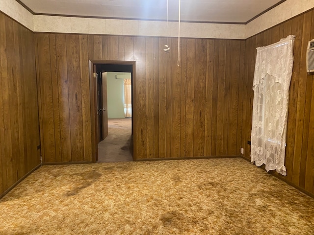 empty room with wood walls and carpet