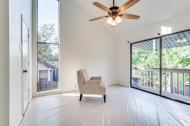 unfurnished room with ceiling fan and vaulted ceiling