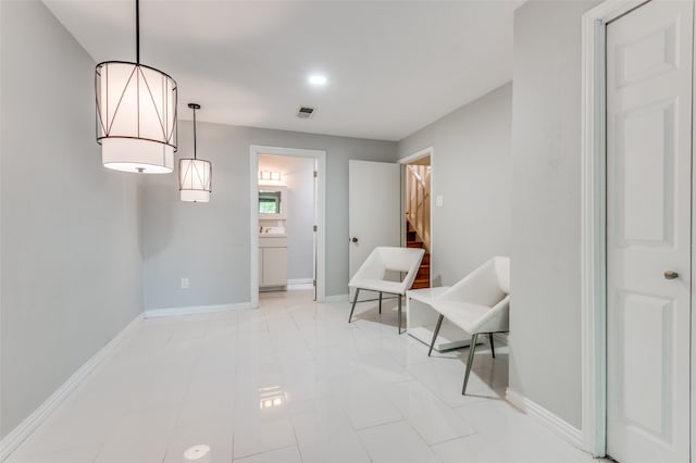 living area featuring light tile patterned flooring