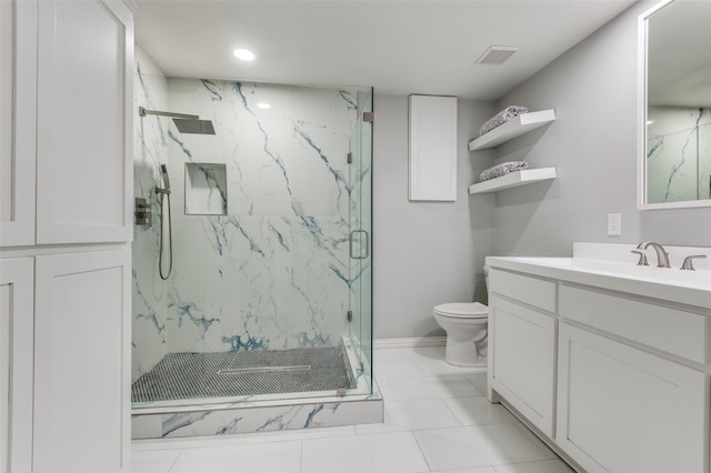 bathroom with vanity, toilet, a shower with shower door, and tile patterned flooring