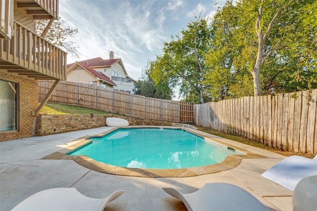 view of pool featuring a patio