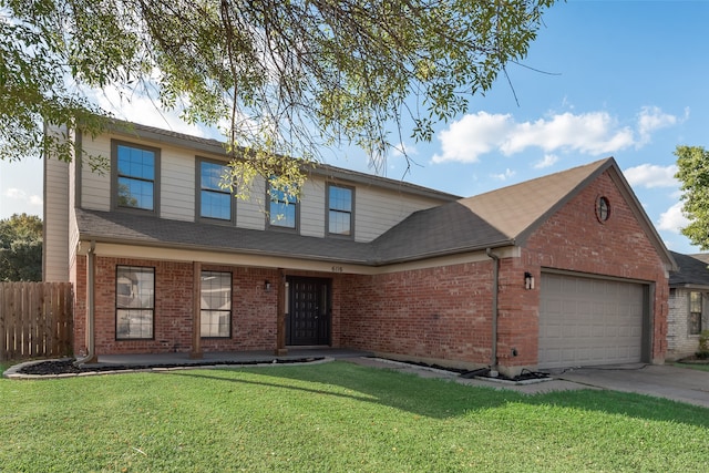 view of front facade with a front yard and a garage