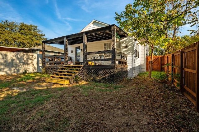 504 E Monterey St, Denison, TX 75021 - rear view of house with a fenced backyard, a wooden deck, and a lawn