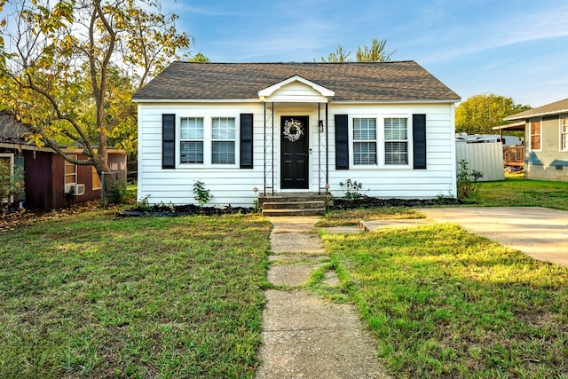 bungalow with a front yard