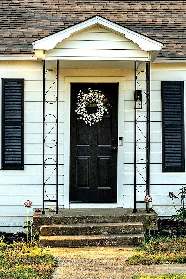 504 E Monterey St, Denison, TX 75021 - doorway to property with a shingled roof