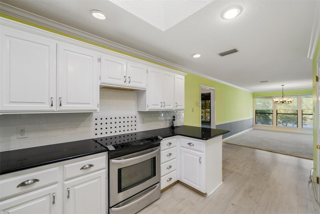 kitchen with stainless steel electric range, white cabinets, tasteful backsplash, light hardwood / wood-style flooring, and crown molding