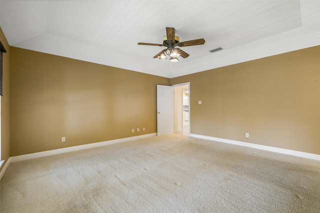 empty room featuring ceiling fan and carpet floors