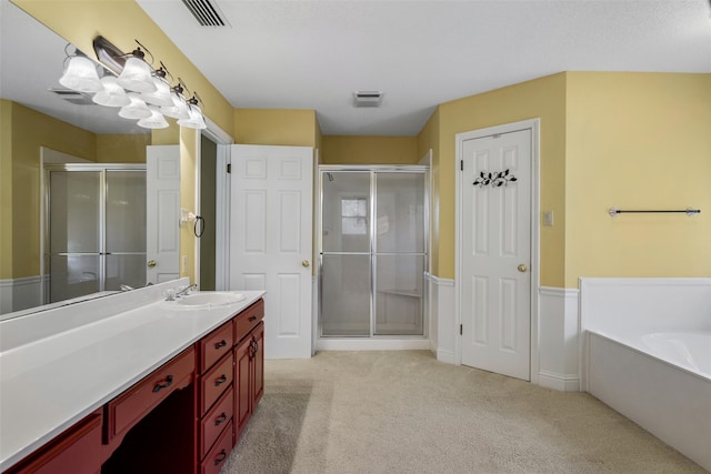 bathroom with vanity and independent shower and bath