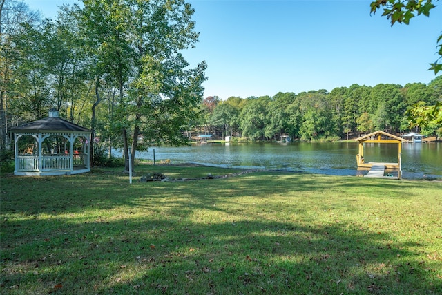 view of yard featuring a gazebo and a water view