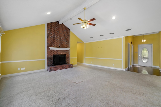 unfurnished living room with vaulted ceiling with beams, ceiling fan, carpet flooring, and a brick fireplace