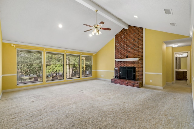 unfurnished living room with lofted ceiling with beams, a brick fireplace, and light colored carpet